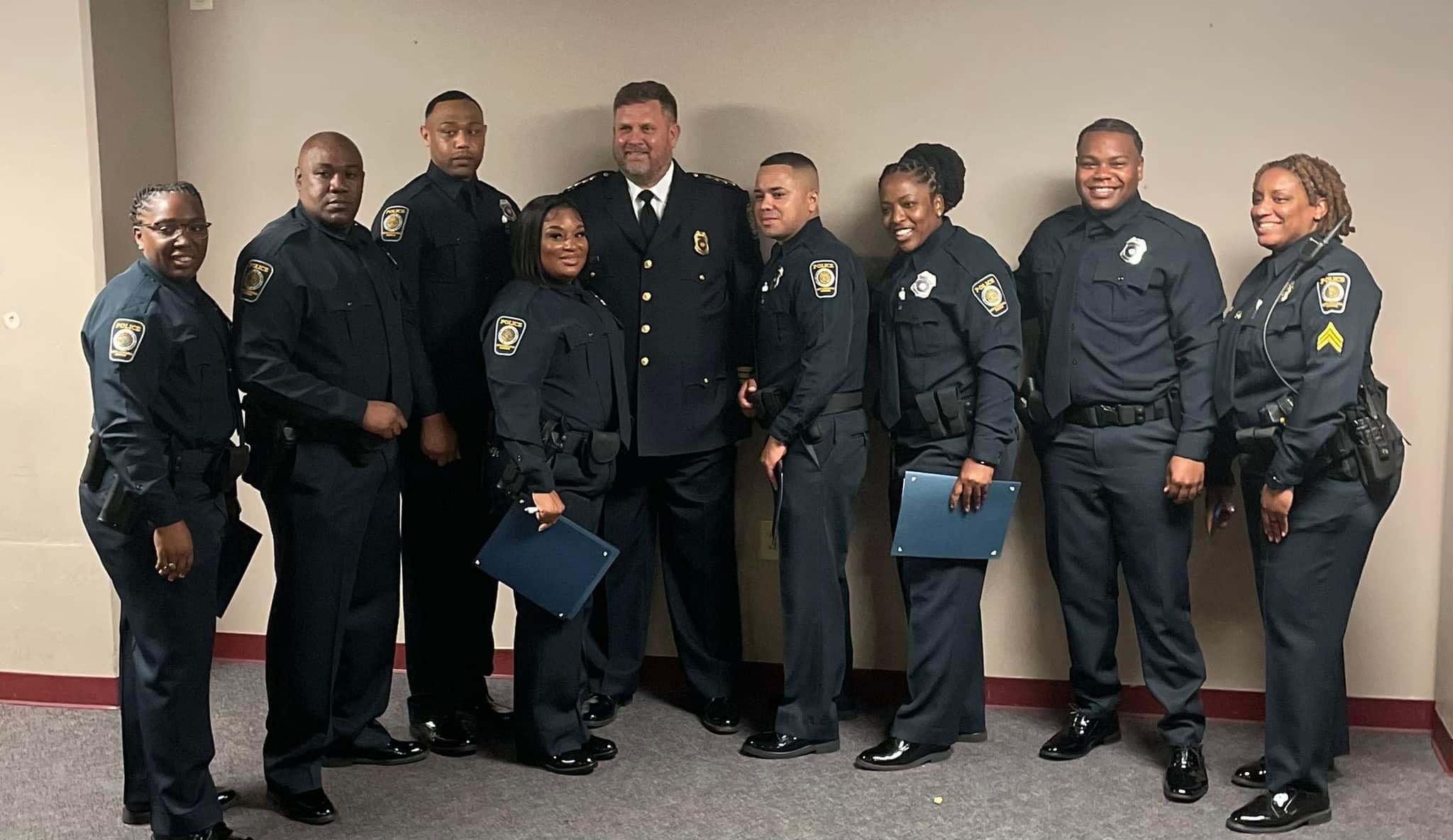 Anthony L. Robbins at police academy graduation ceremony with fellow officers